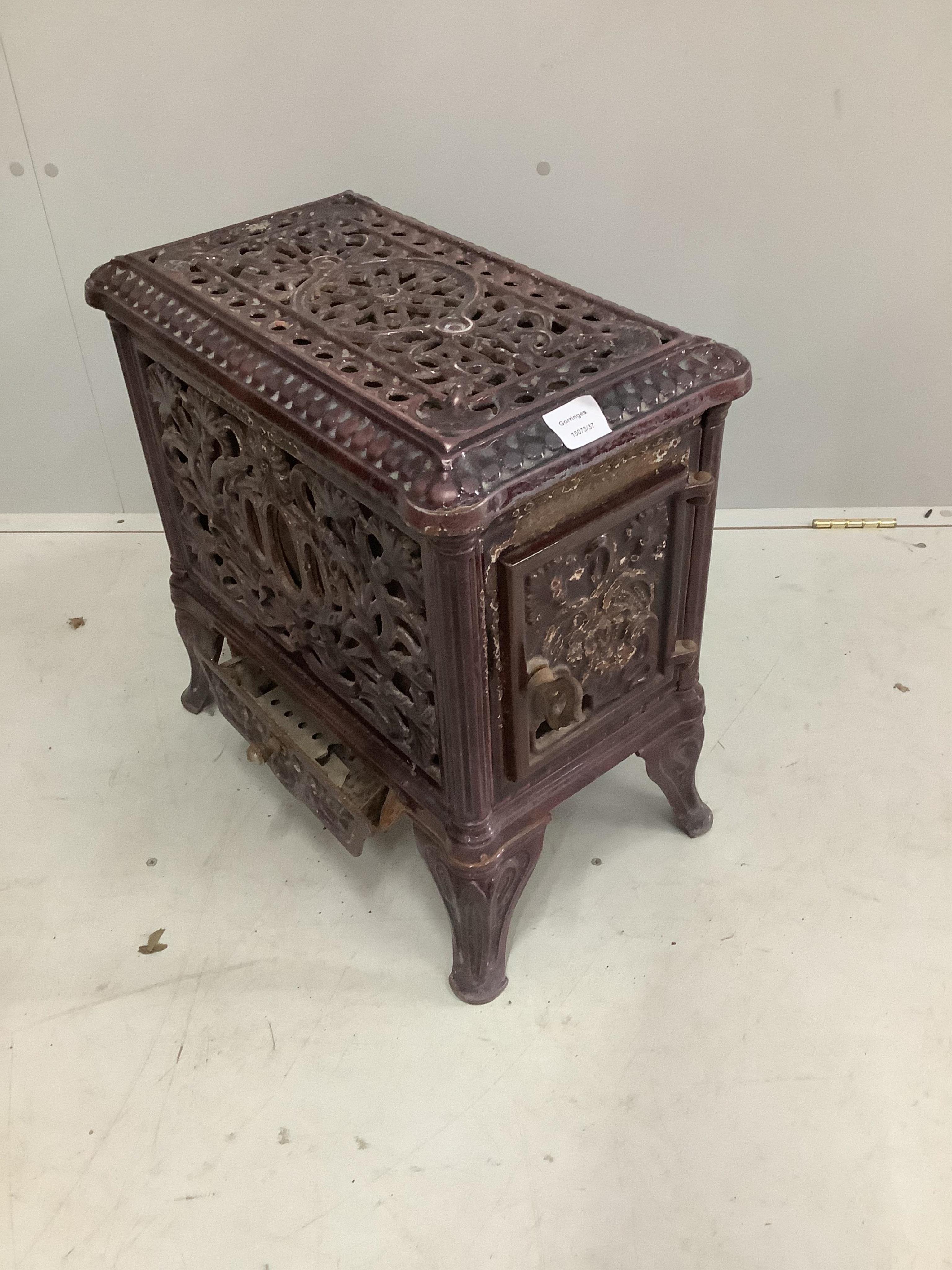 A late 19th / early 20th century French enamelled heater, width 51cm, depth 31cm, height 50cm. Condition - fair